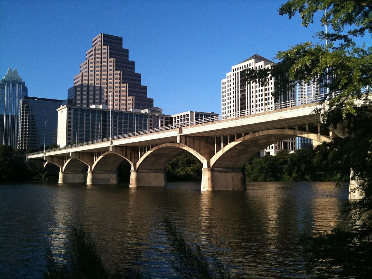 thousands of Mexican free-tailed bats emerging at dusk from under the Congress Avenue Bridge in Austin
