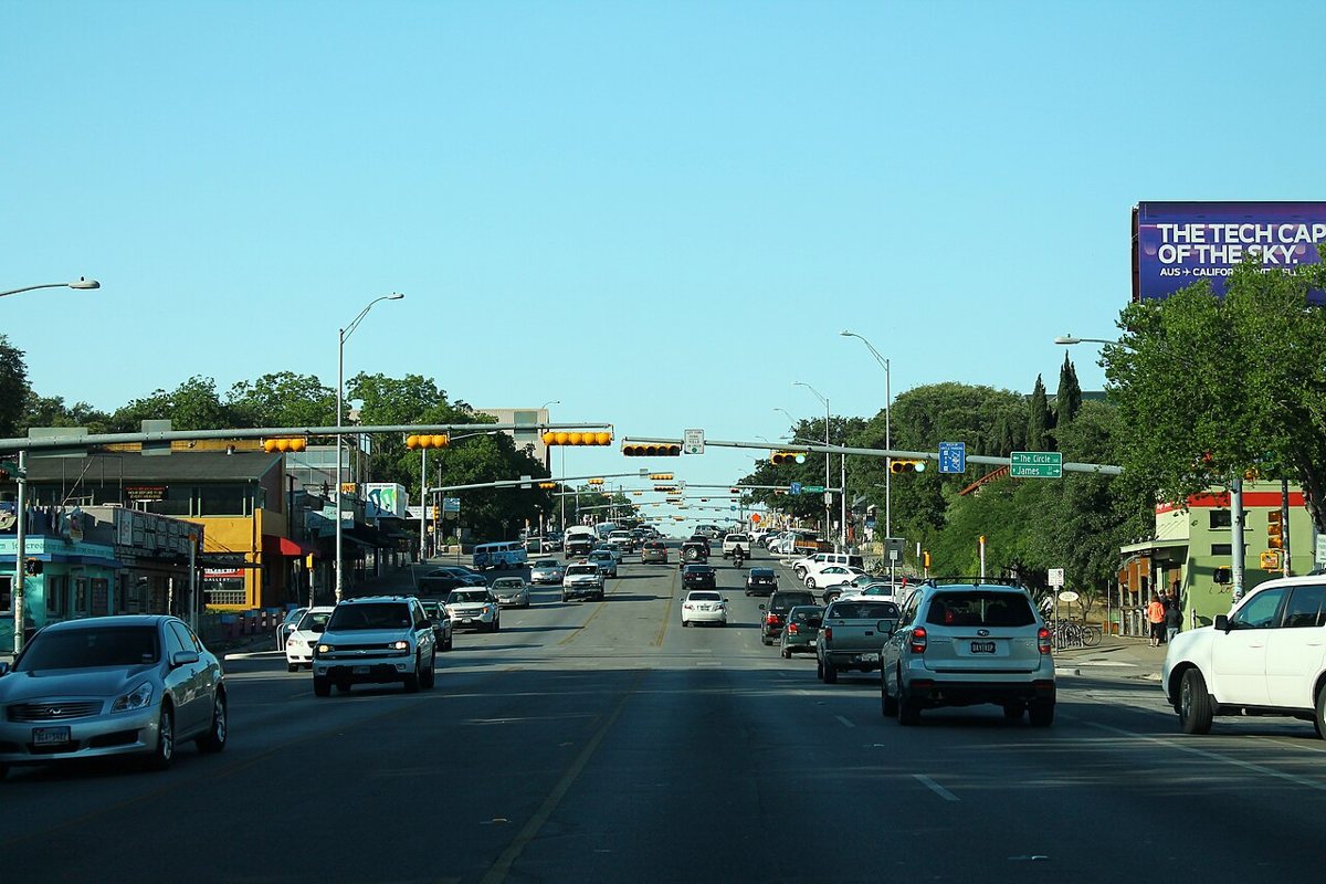 South Congress Avenue SoCo strip in Austin Texas with vintage shops and the Austin skyline in the distance
