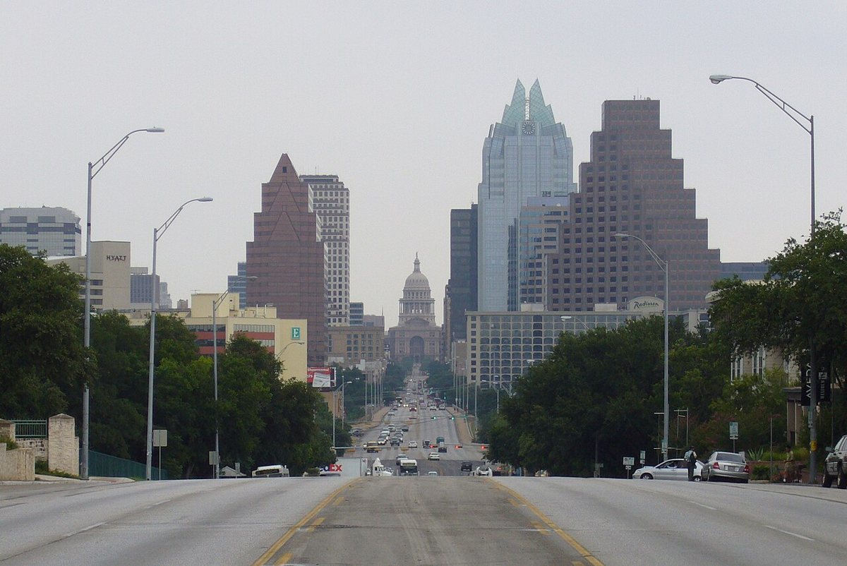 the downtown Austin skyline framed by South Congress Avenue
